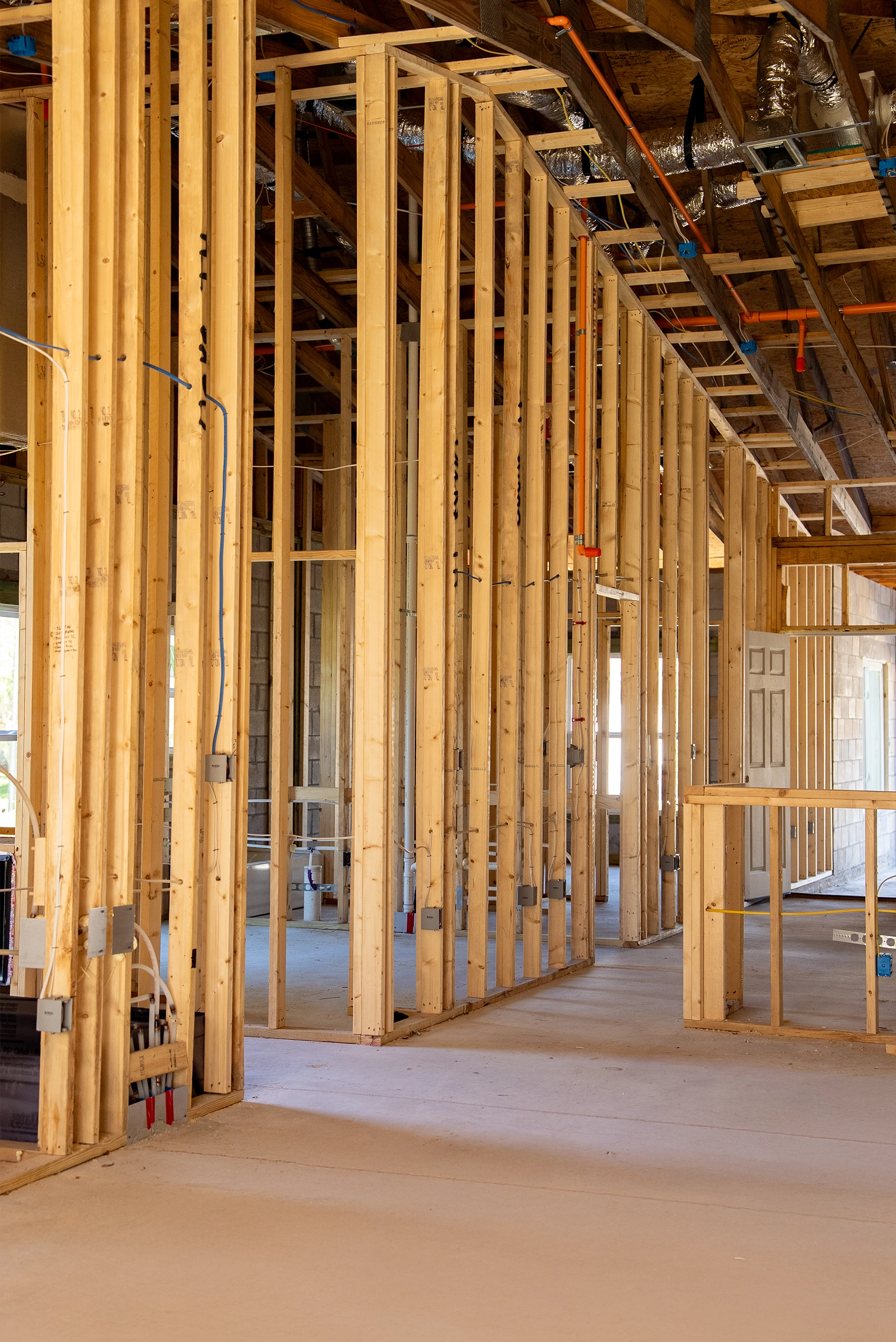 Interior rough-in framing showing the layout of load-bearing walls and overhead mechanical systems.